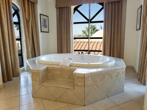 Premium bedding, down comforters, pillowtop beds, minibar