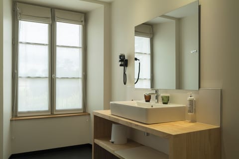 Deluxe Room, 1 King Bed, Pool Access | Bathroom | Shower, hydromassage showerhead, eco-friendly toiletries, hair dryer