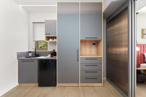 Superior Triple Room, Sea View | Private kitchen | Fridge, highchair