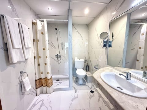 Deluxe Double Room, Garden View | Bathroom | Shower, hair dryer, towels, soap