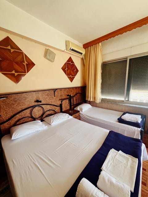Classic Triple Room, Balcony, Sea View | Desk, laptop workspace, free WiFi, bed sheets