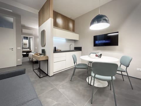 Deluxe Apartment | Living area | TV