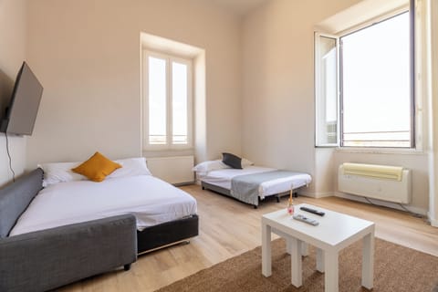 Family Quadruple Room, City View | Desk, laptop workspace, free WiFi