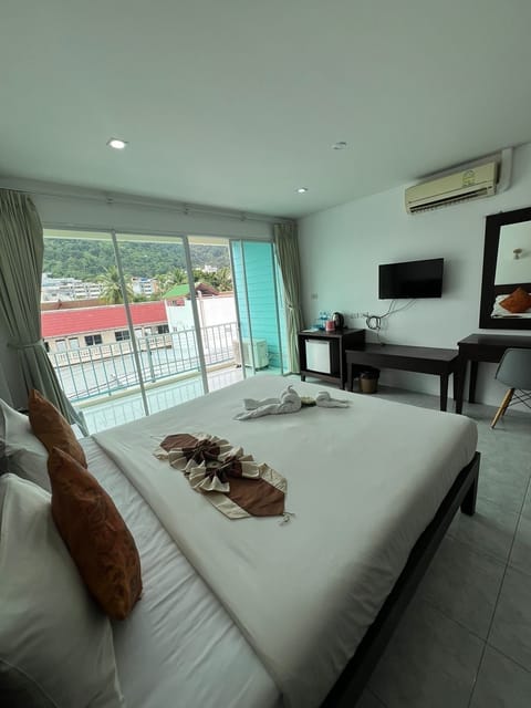 Deluxe Double Room, City View | In-room safe, desk, laptop workspace, iron/ironing board