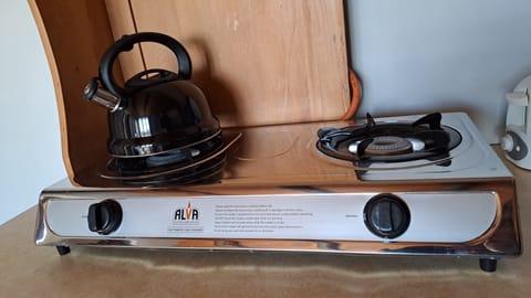 Apartment, Patio, Garden Area | Private kitchen | Full-size fridge, microwave, toaster, cookware/dishes/utensils