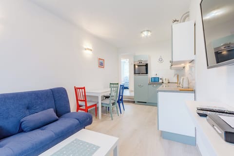 Apartment (Two Bedroom Apartment with Balcony (M) | Living room | 32-inch flat-screen TV with cable channels