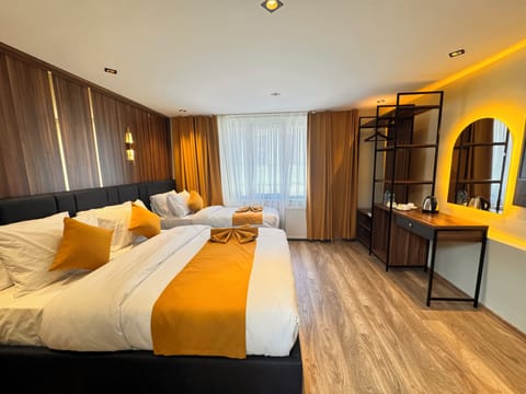 Standard Triple Room | Minibar, desk, laptop workspace, blackout drapes