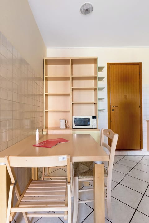 Espresso maker, electric kettle, dining tables