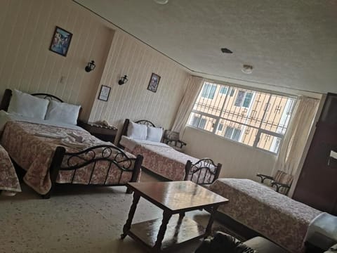 Family Quadruple Room | Desk, blackout drapes, free WiFi, bed sheets