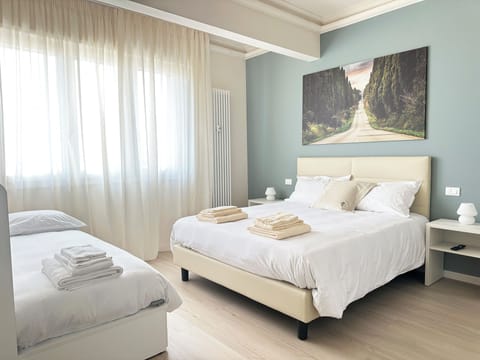 Deluxe Quadruple Room, Balcony | Premium bedding, down comforters, in-room safe, individually decorated