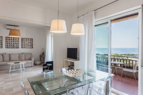 Apartment, Sea View | Living area | 32-inch flat-screen TV with cable channels