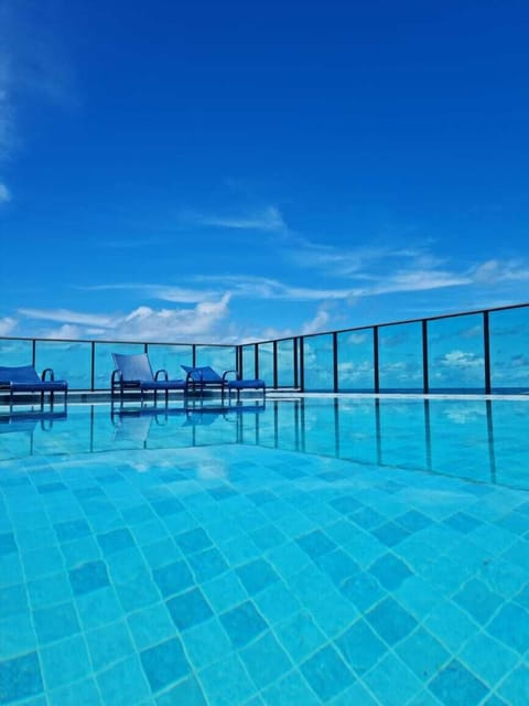 Outdoor pool, open 8:00 AM to 8:00 PM, pool umbrellas, sun loungers