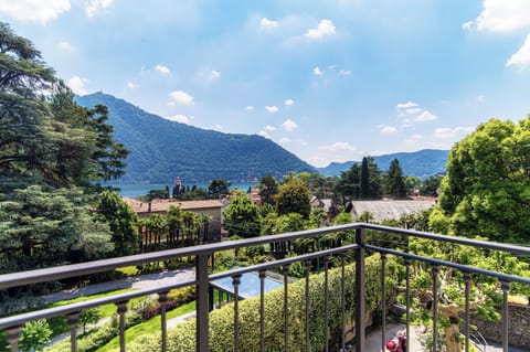 Deluxe Quadruple Room, Lake View | Minibar, in-room safe, desk, soundproofing