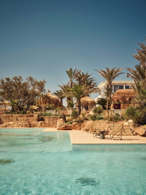 Outdoor pool, free cabanas, pool umbrellas