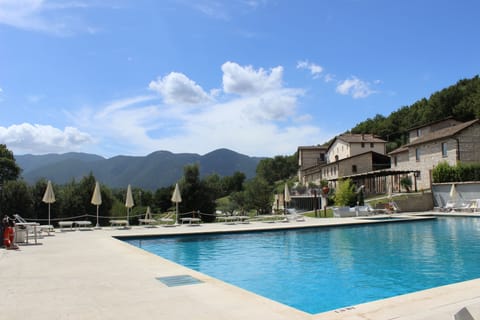 Seasonal outdoor pool, pool umbrellas, sun loungers