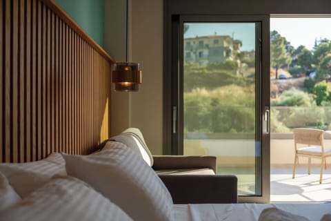 Junior Room, 1 Queen Bed with Sofa bed, Balcony | In-room safe, desk, free WiFi, bed sheets