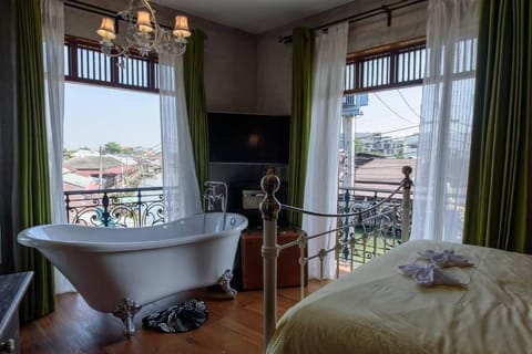 Junior Room, Non Smoking, River View | Bathroom | Hair dryer, slippers, towels