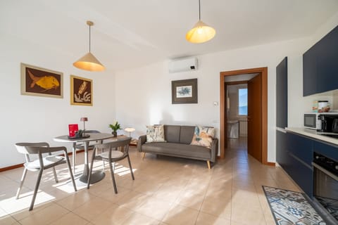 Apartment, Patio, Garden View | Living area | 35-inch TV with digital channels