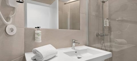 Bathtub, hair dryer, towels, soap