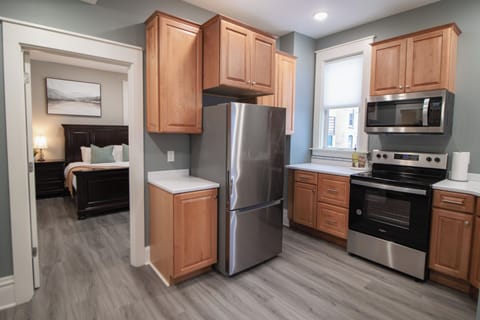 One Bedroom Apartment Unit 4 | Private kitchen | Full-size fridge, microwave, oven, stovetop