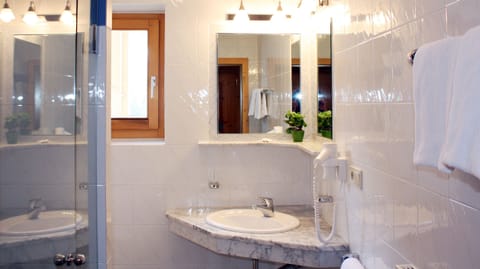 Shower, designer toiletries, hair dryer, bidet