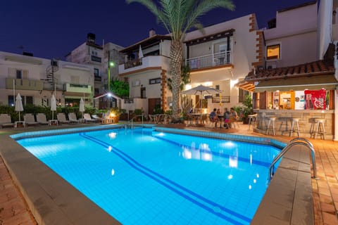 Seasonal outdoor pool, open 9 AM to 7:00 PM, pool umbrellas