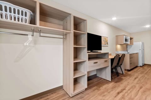 Desk, laptop workspace, bed sheets