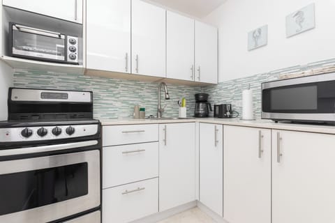 Panoramic Apartment | Private kitchen | Coffee/tea maker, toaster, cookware/dishes/utensils, dining tables