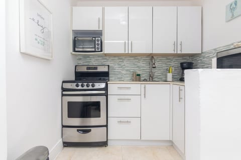 Panoramic Apartment | Private kitchen | Coffee/tea maker, toaster, cookware/dishes/utensils, dining tables