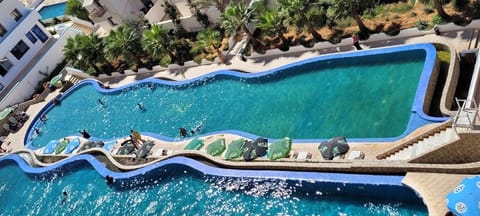 Seasonal outdoor pool, pool umbrellas, sun loungers
