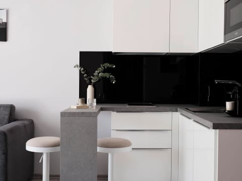 Deluxe Suite, Balcony, City View | Private kitchenette | Fridge, microwave, stovetop, espresso maker