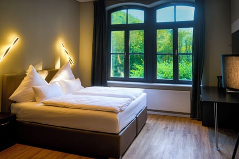 King Suite with Spa Bath | Premium bedding, down comforters, blackout drapes, free WiFi