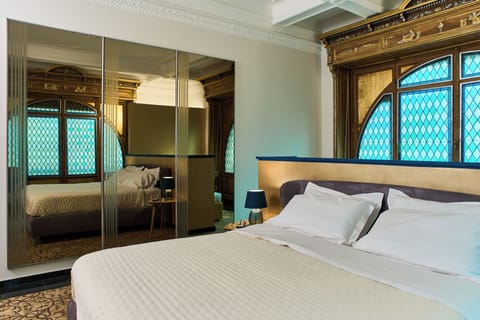 Luxury Suite, Balcony, City View | In-room safe, desk, laptop workspace, blackout drapes