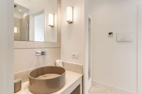 Deluxe Double Room, Courtyard View | Bathroom | Shower, hair dryer, towels, soap