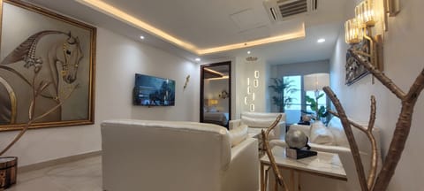 Luxury Apartment, 1 King Bed, City View | Living area | 50-inch LED TV with digital channels, Netflix, streaming services
