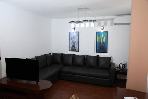 Family Quadruple Room | Living area | 42-inch flat-screen TV with satellite channels, stereo