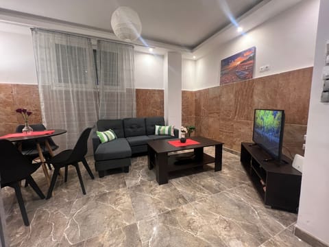 Apartment | Living area | 30-inch flat-screen TV with digital channels
