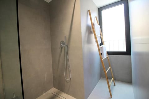 Deluxe Family Room, Balcony, Partial Sea View | Bathroom | Shower, hair dryer, slippers, towels