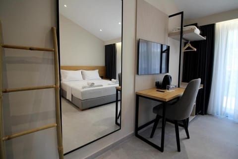 Deluxe Double Room, French Balcony | Minibar, in-room safe, desk, blackout drapes
