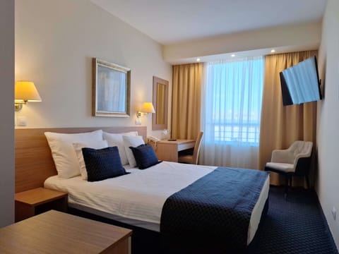 Superior Room | Desk, laptop workspace, blackout drapes, iron/ironing board