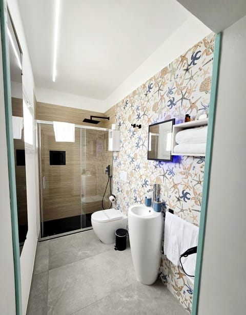 Shower, free toiletries, hair dryer, slippers