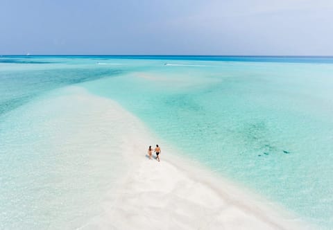 Beach nearby, white sand, beach towels