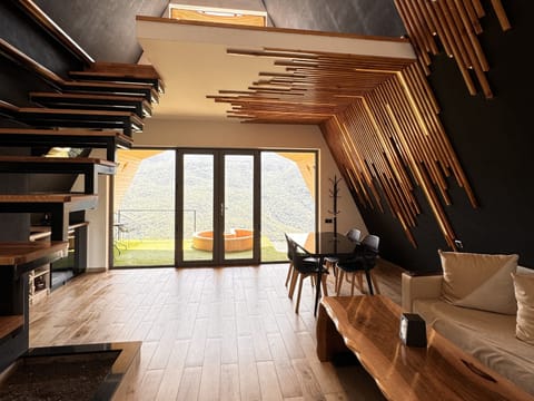 Deluxe Cottage, Balcony, Mountain View | Living area | TV, heated floors