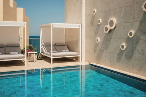 Indoor pool, outdoor pool, pool umbrellas, sun loungers