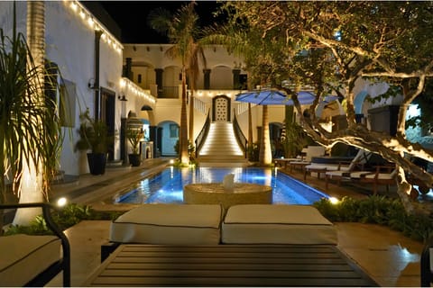 Outdoor pool, open 8:00 AM to midnight, pool umbrellas, sun loungers