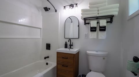 Studio, 2 Queen Beds | Bathroom | Combined shower/tub, hair dryer, towels, soap
