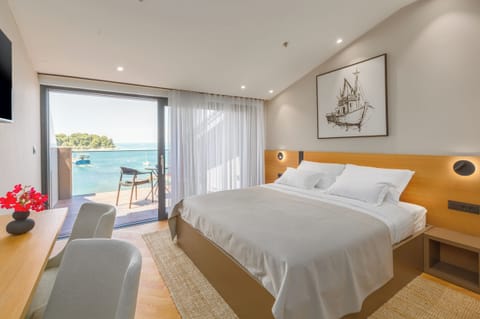 Deluxe Double Room, Balcony, Sea View | Minibar, desk, laptop workspace, soundproofing