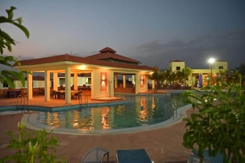 Outdoor pool, open 8:00 AM to 8:00 PM, pool umbrellas, sun loungers