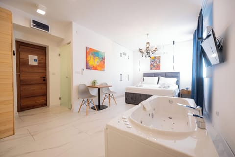 Deluxe Suite, Sauna, Basement | In-room safe, desk, laptop workspace, soundproofing