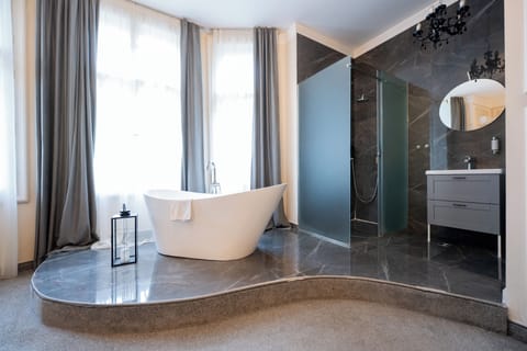 Royal Studio Suite, City View | Bathroom | Hair dryer, slippers, towels, soap